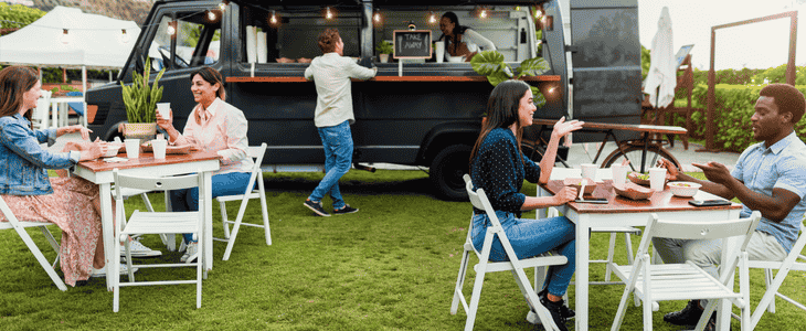 a family getting food at a food festival